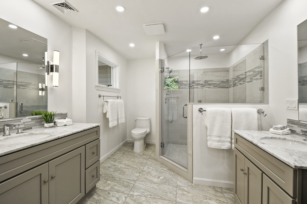 55 Prospect Hill Road Harvard, MA 01451 - Photo 26 of 42 a spacious bathroom with a granite countertop sink mirror and toilet