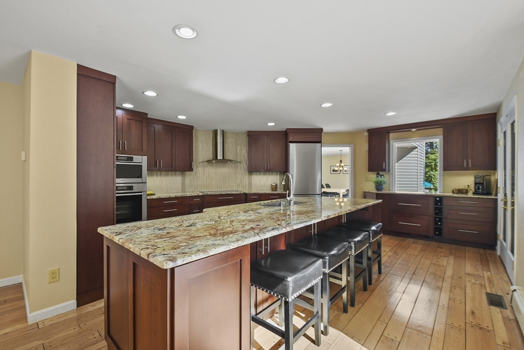 55 Prospect Hill Road Harvard, MA 01451 - Photo 9 of 42 a kitchen with a table and chairs in it