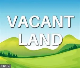 a view of a wooden floor with windows and white