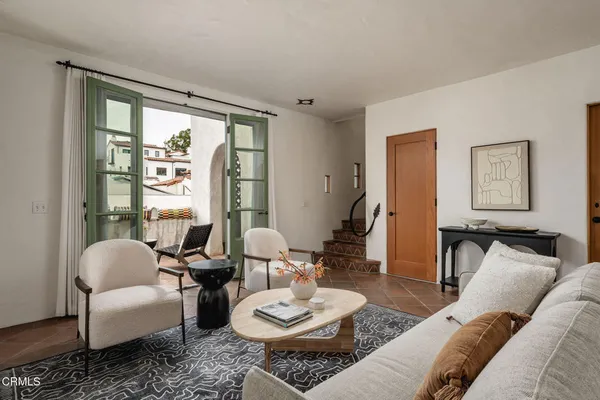 a living room with furniture and a large window