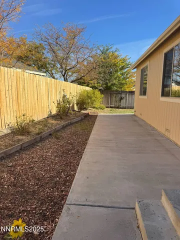 a view of backyard with green space