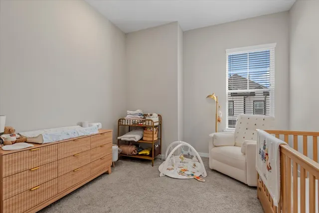 a bedroom with bed and a window