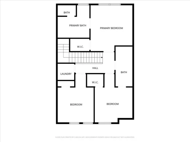 a picture of a bench in front of a wall