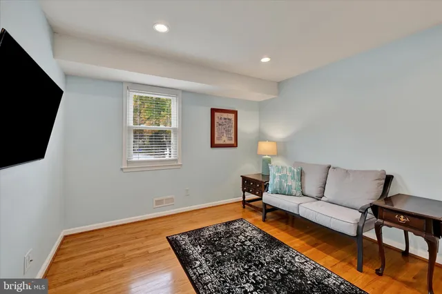 a living room with furniture and a rug