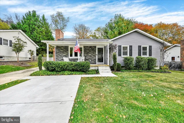 a view of front of house with a yard