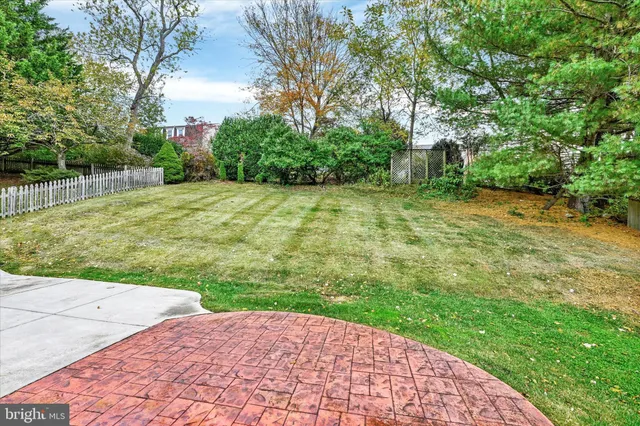 a aerial view of a house with table and chairs