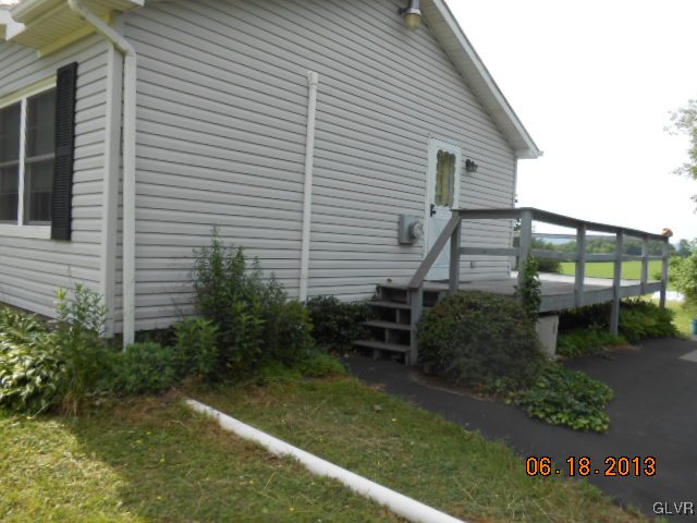 124 Rolling View Road Palmerton, PA 18071 - Photo 13 of 15 a backyard of a house with lots of green space