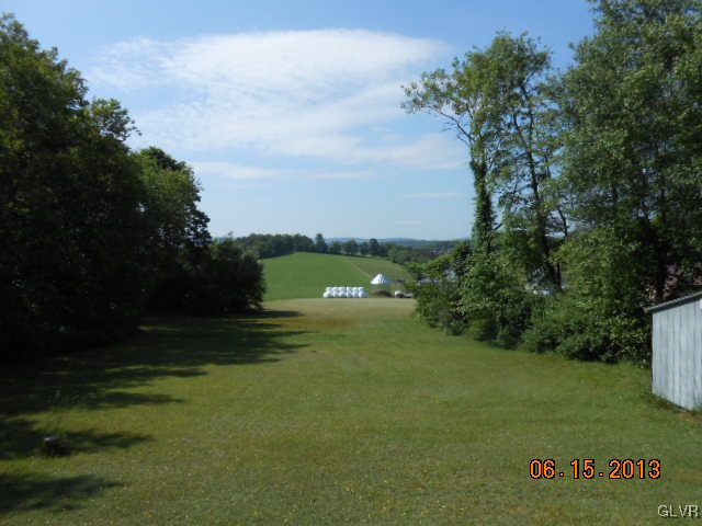 124 Rolling View Road Palmerton, PA 18071 - Photo 14 of 15 a view of a golf course with a lake