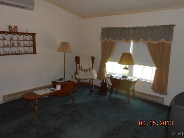 124 Rolling View Road Palmerton, PA 18071 - Photo 2 of 15 a living room with furniture and a table