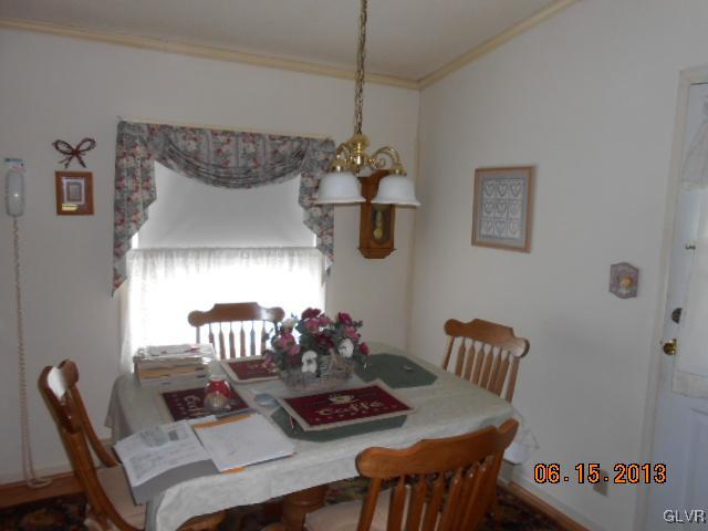 124 Rolling View Road Palmerton, PA 18071 - Photo 5 of 15 a table and chairs in a small kitchen