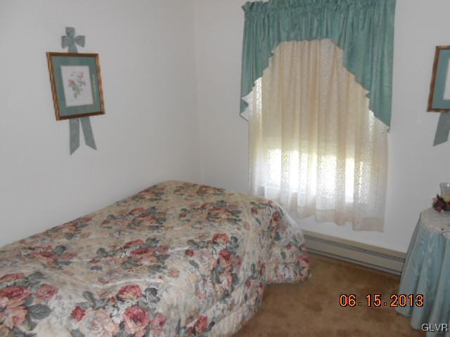 124 Rolling View Road Palmerton, PA 18071 - Photo 8 of 15 a bedroom with a bed and a window