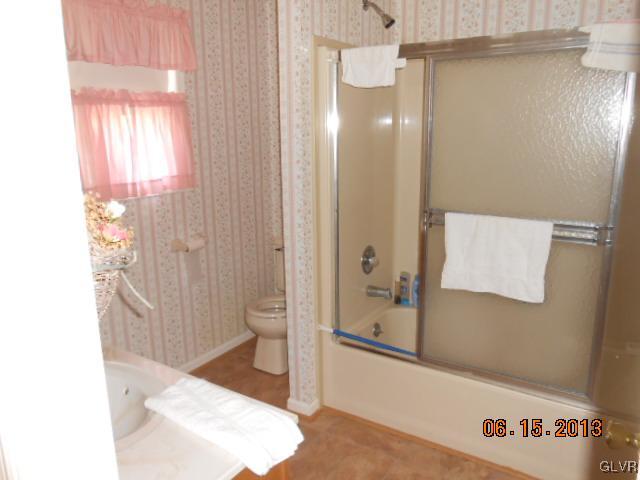 124 Rolling View Road Palmerton, PA 18071 - Photo 10 of 15 a bathroom with a shower and a toilet