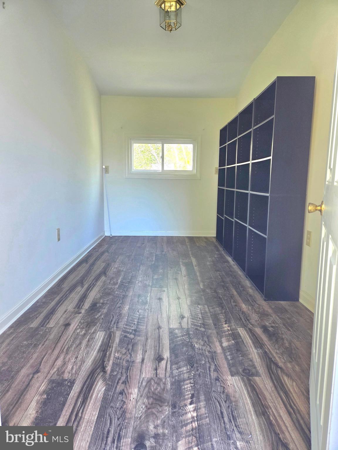 405 Leonards Lane Cambridge, MD 21613 - Photo 12 of 33 a view of empty room with wooden floor and fan