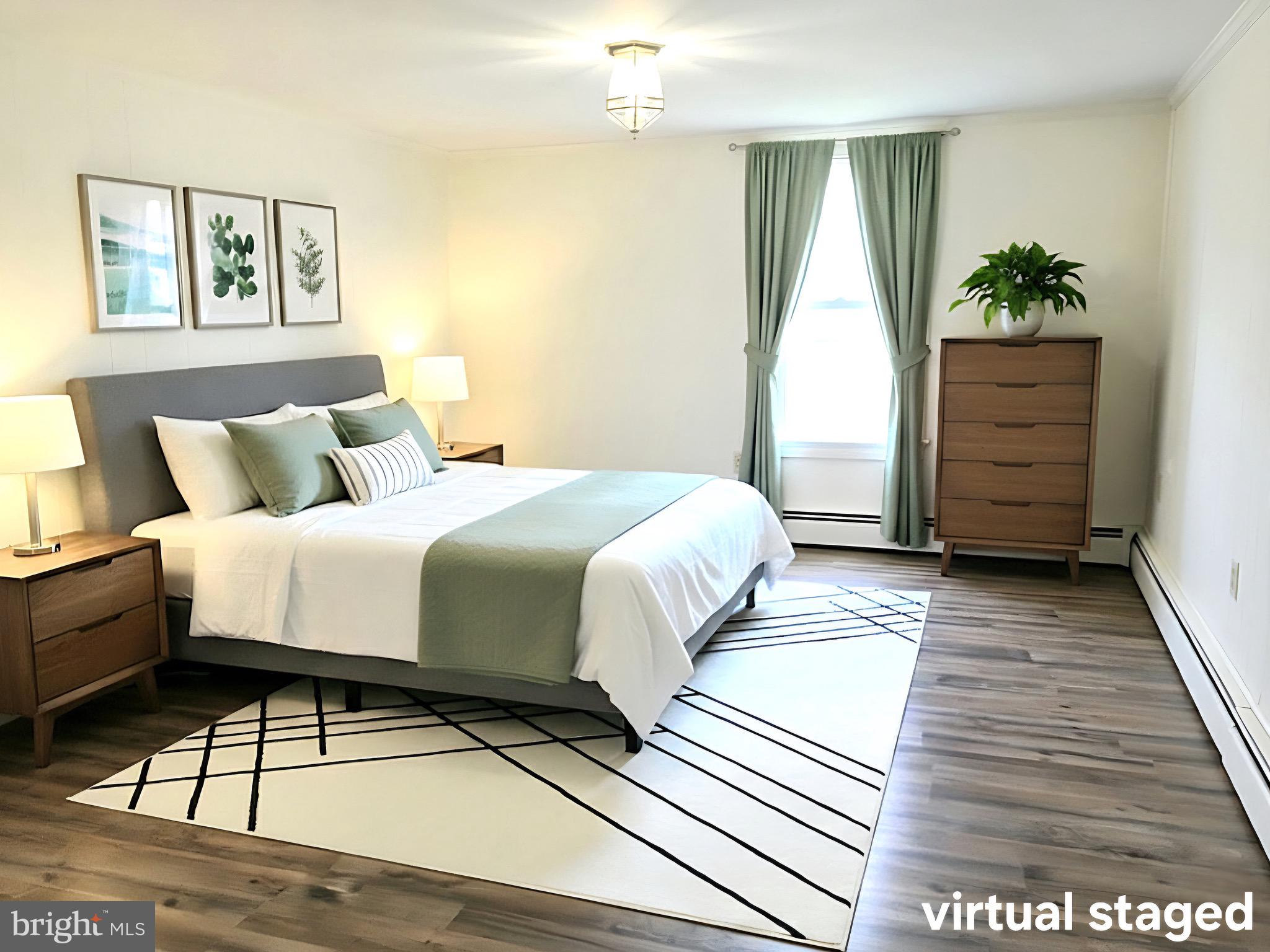 405 Leonards Lane Cambridge, MD 21613 - Photo 13 of 33 a spacious bedroom with a bed and a window