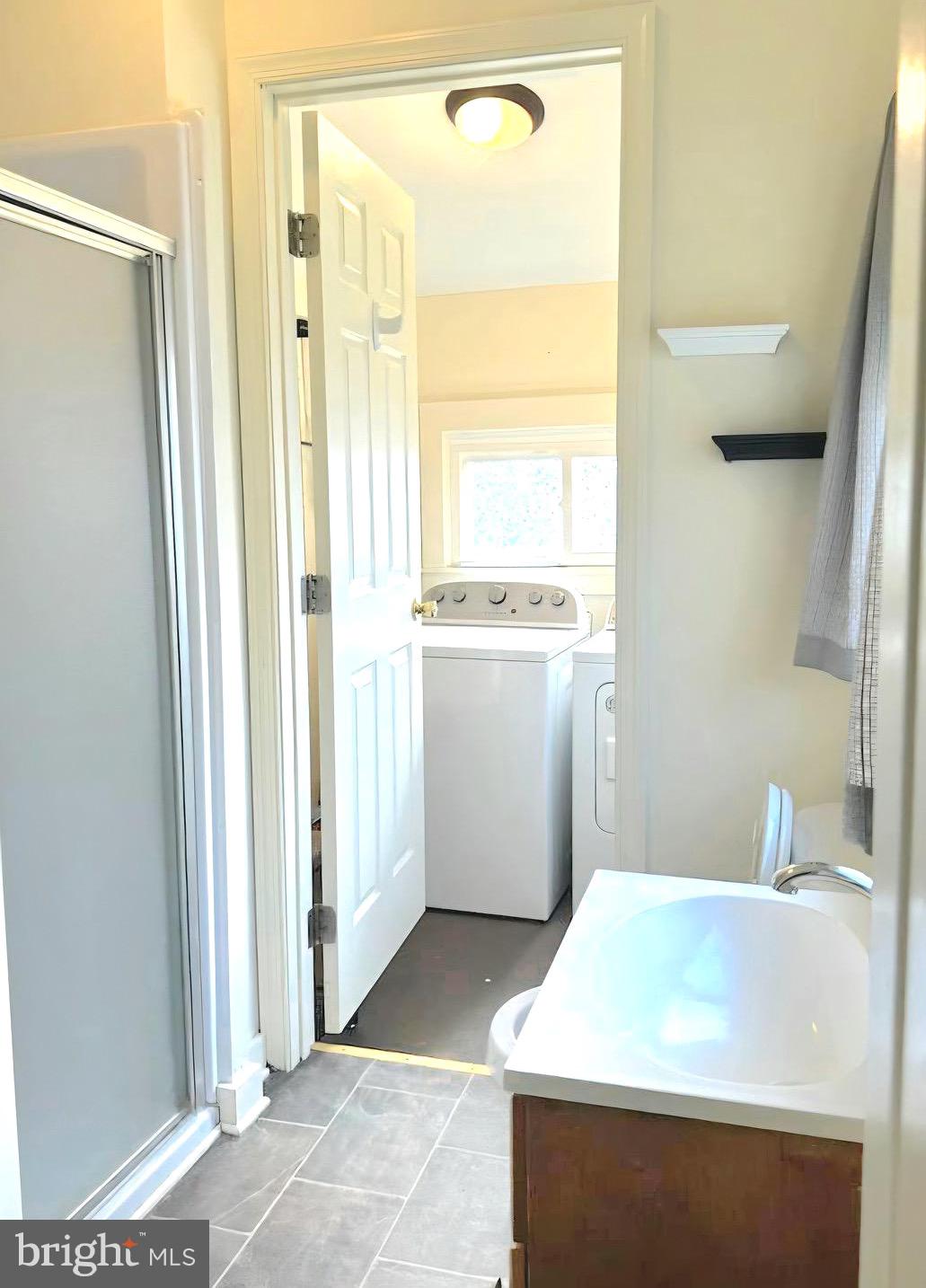 405 Leonards Lane Cambridge, MD 21613 - Photo 17 of 33 a bathroom with a sink a toilet and a shower