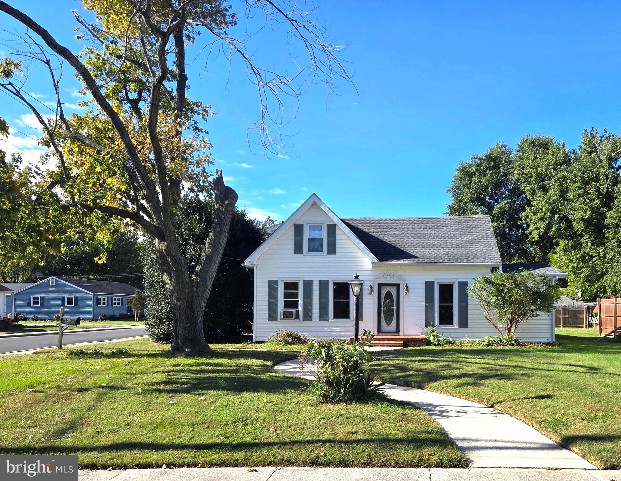 405 Leonards Lane Cambridge, MD 21613 - Photo 2 of 33 a front view of a house with a garden