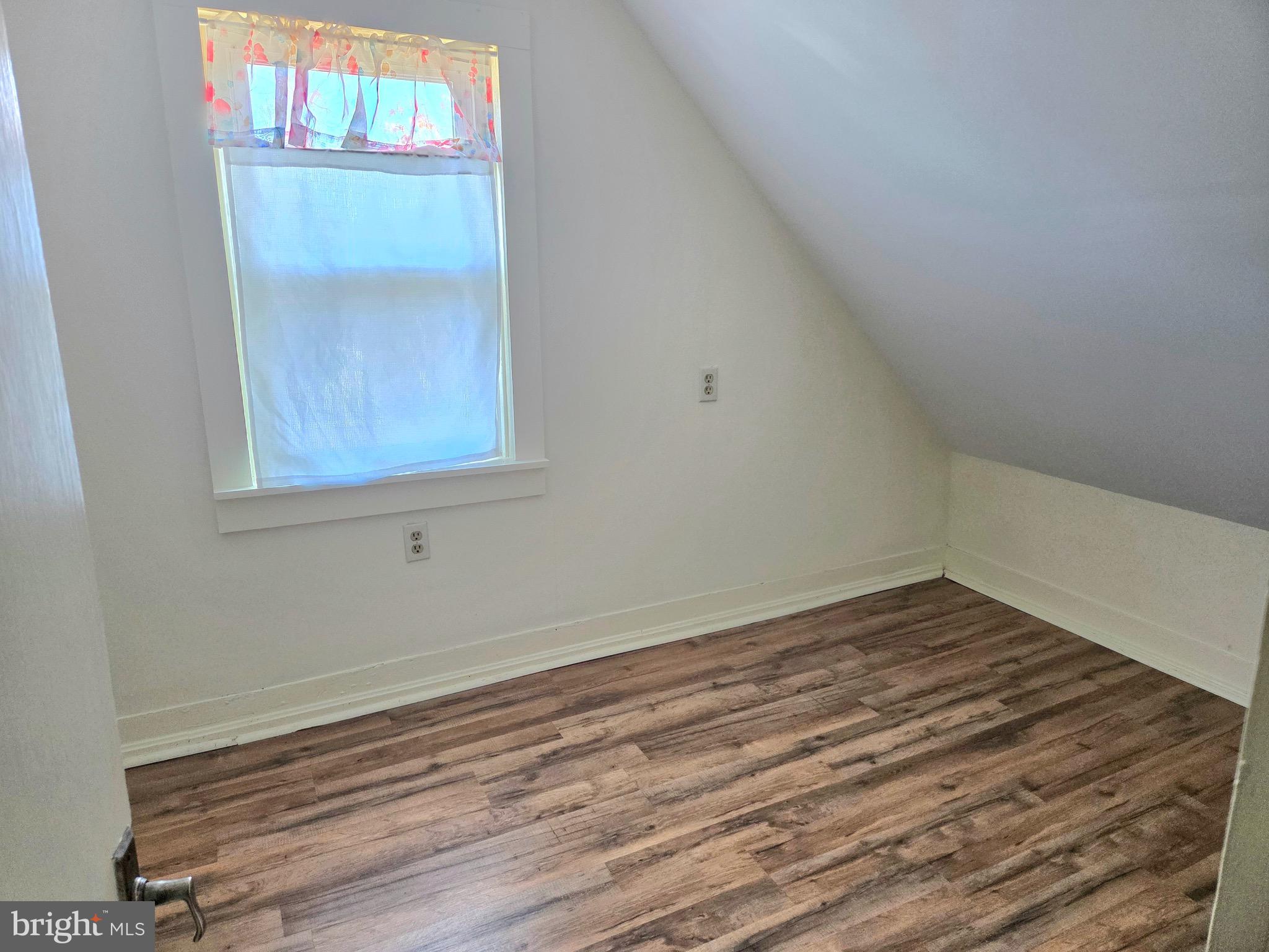 405 Leonards Lane Cambridge, MD 21613 - Photo 27 of 33 a view of a small space with wooden floor and a window