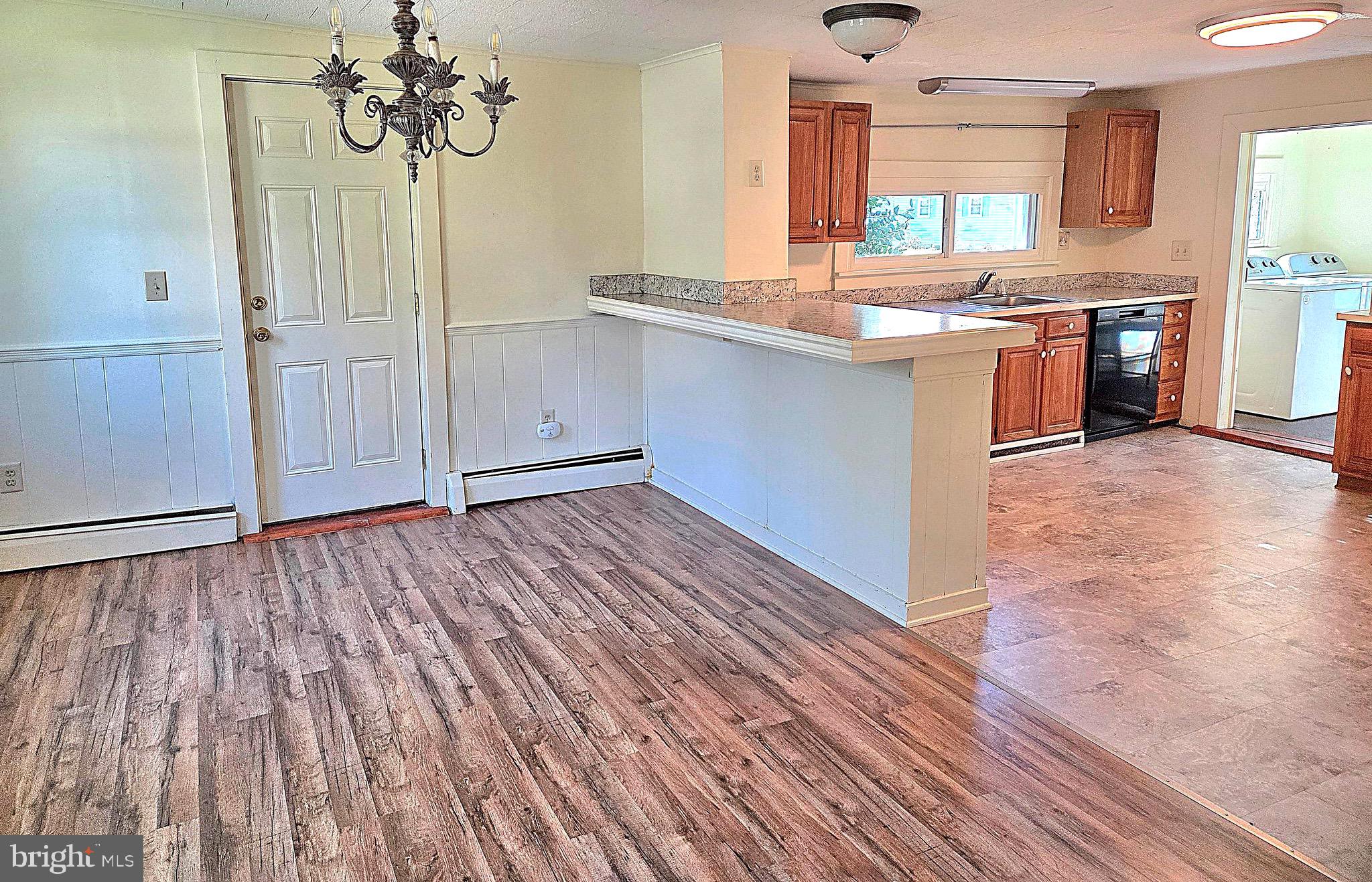405 Leonards Lane Cambridge, MD 21613 - Photo 5 of 33 a view of a kitchen with wooden floor and cabinets