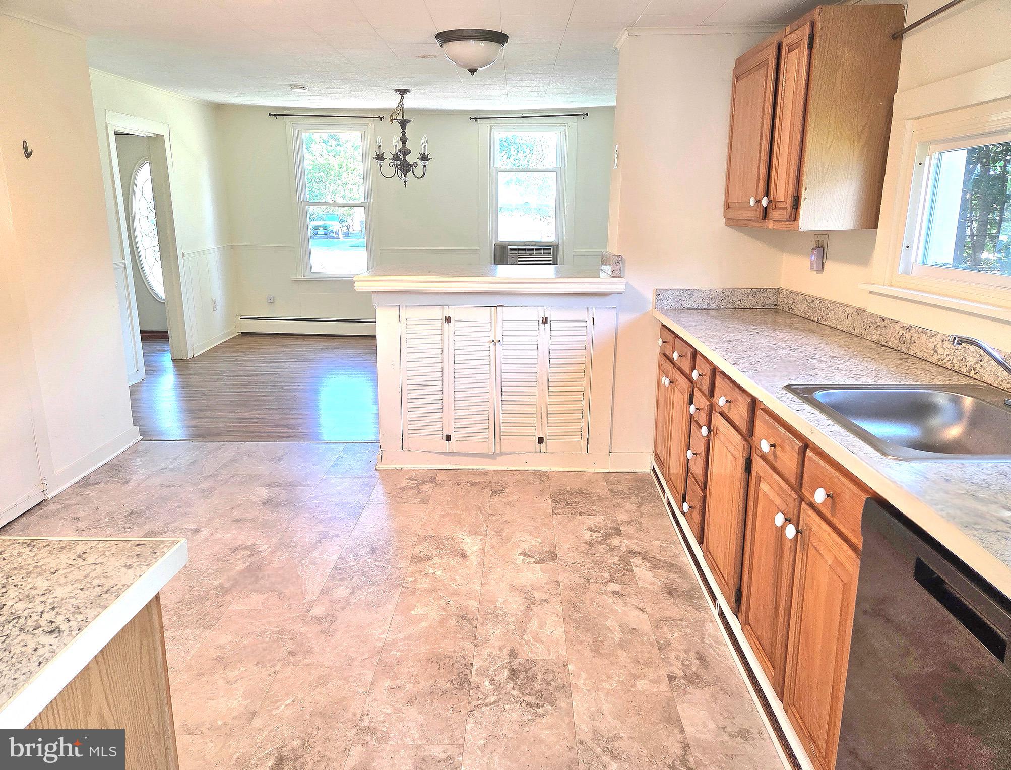 405 Leonards Lane Cambridge, MD 21613 - Photo 7 of 33 a view of a kitchen with granite countertop white cabinets and sink