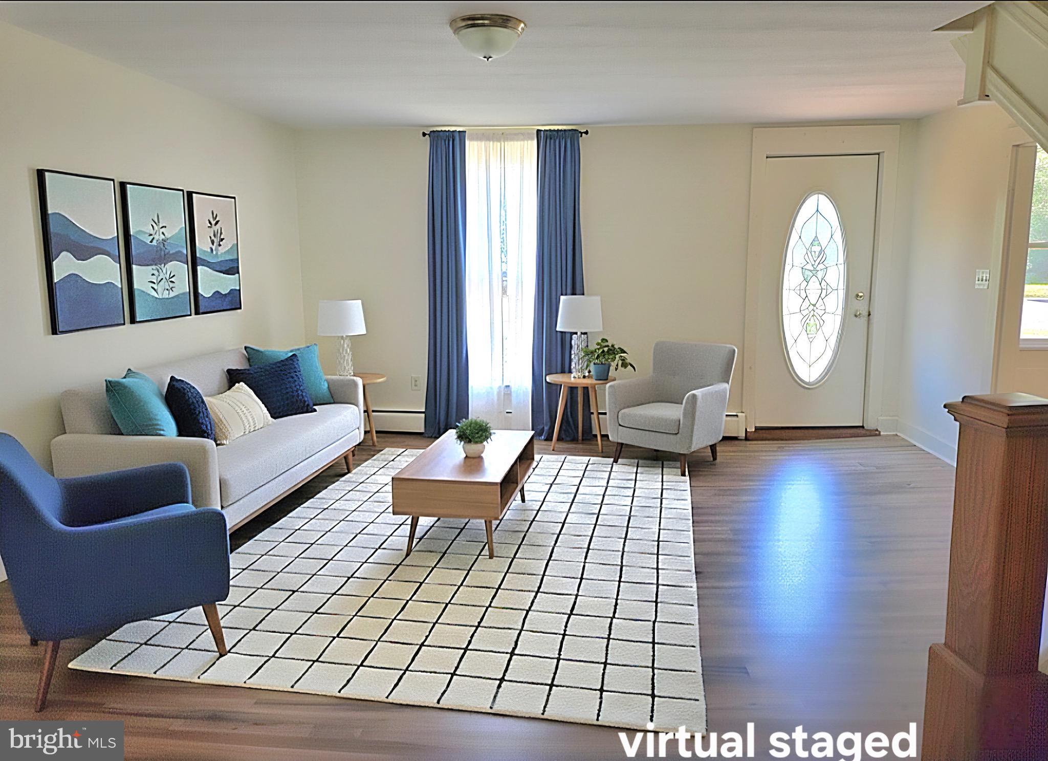 405 Leonards Lane Cambridge, MD 21613 - Photo 8 of 33 a living room with furniture and a large window