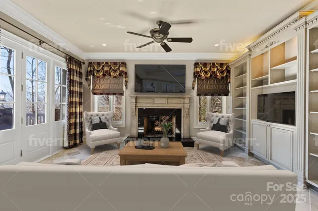 a view of a dining room with furniture and a chandelier