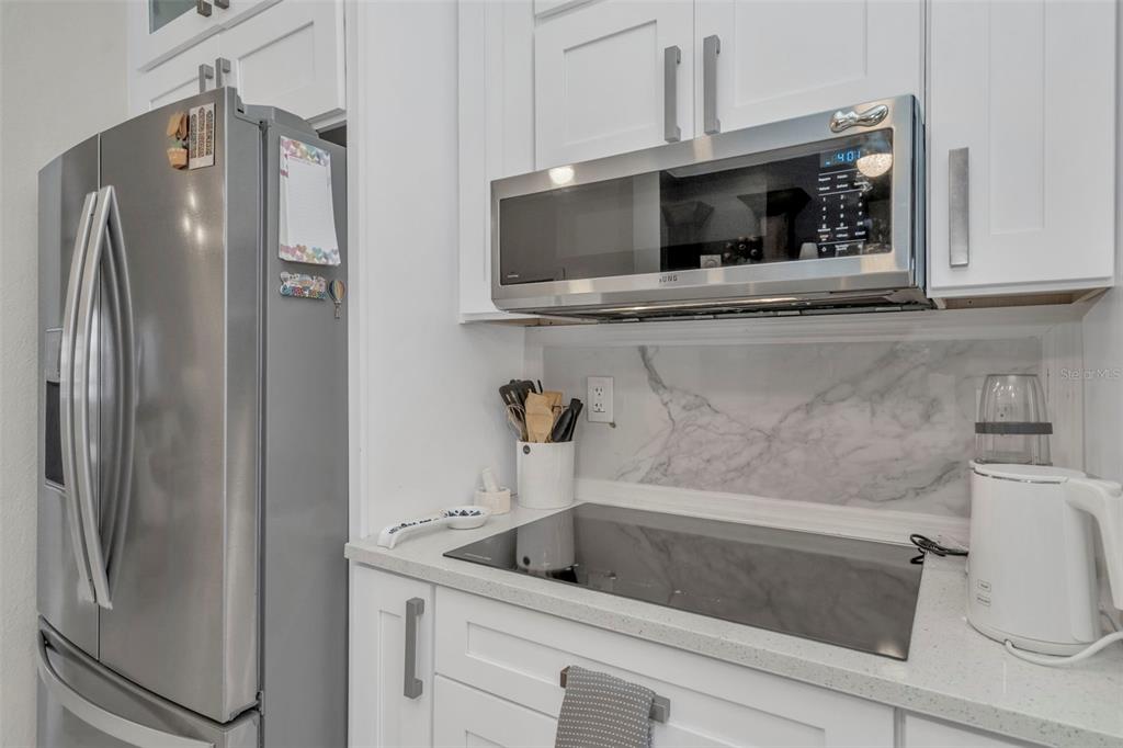 6765 Lake Rochester Lane Gibsonton, FL 33534 - Photo 14 of 33 a bathroom with a sink and a microwave