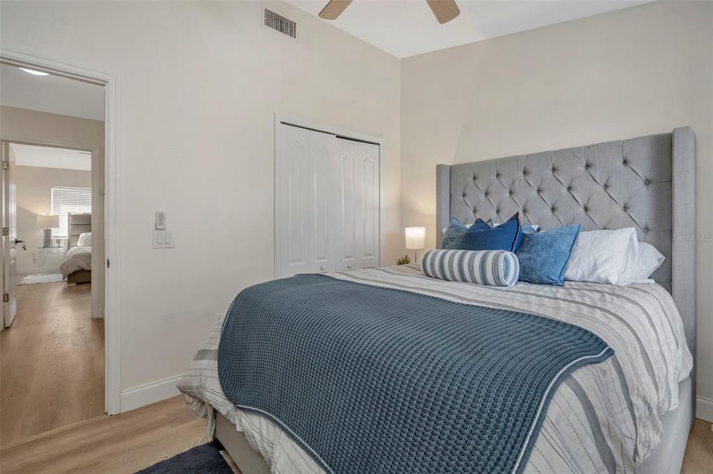 6765 Lake Rochester Lane Gibsonton, FL 33534 - Photo 20 of 33 a bedroom with a bed and a mirror