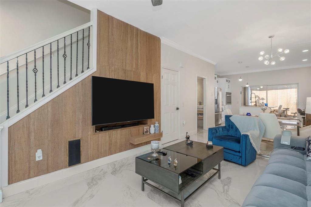 6765 Lake Rochester Lane Gibsonton, FL 33534 - Photo 2 of 33 a living room with furniture and a flat screen tv