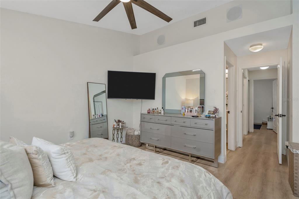 6765 Lake Rochester Lane Gibsonton, FL 33534 - Photo 24 of 33 a bedroom with a bed and a flat screen tv