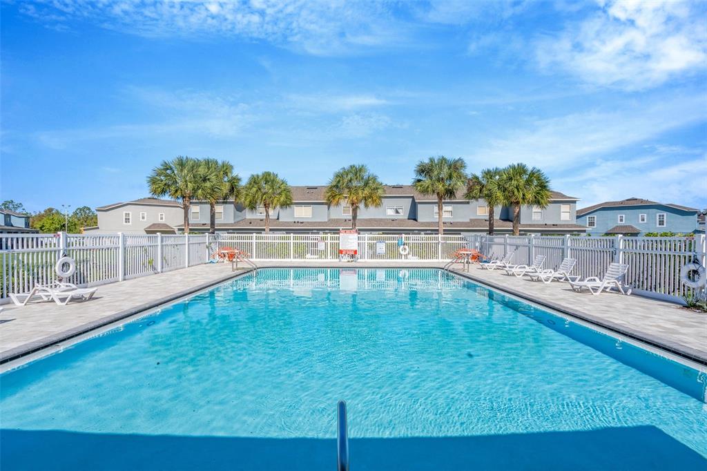 6765 Lake Rochester Lane Gibsonton, FL 33534 - Photo 28 of 33 a view of a swimming pool with an outdoor seating