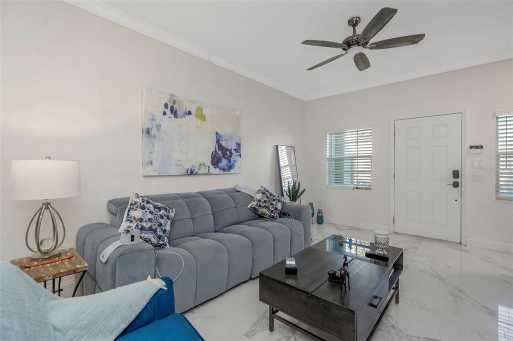 6765 Lake Rochester Lane Gibsonton, FL 33534 - Photo 4 of 33 a living room with furniture and a wooden floor
