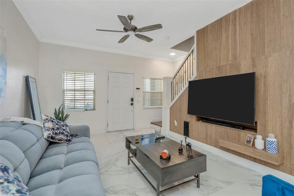 6765 Lake Rochester Lane Gibsonton, FL 33534 - Photo 5 of 33 a living room with furniture and a flat screen tv