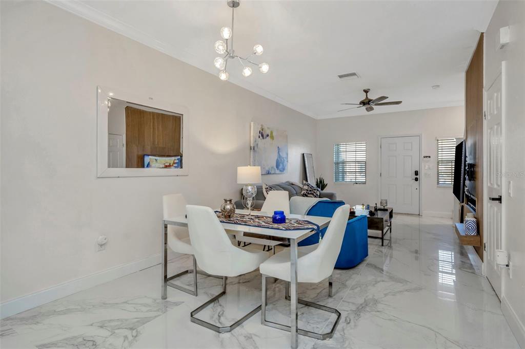 6765 Lake Rochester Lane Gibsonton, FL 33534 - Photo 7 of 33 a dining room with furniture and window