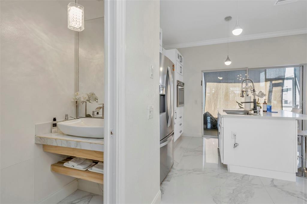 6765 Lake Rochester Lane Gibsonton, FL 33534 - Photo 8 of 33 a bathroom with a tub sink and mirror