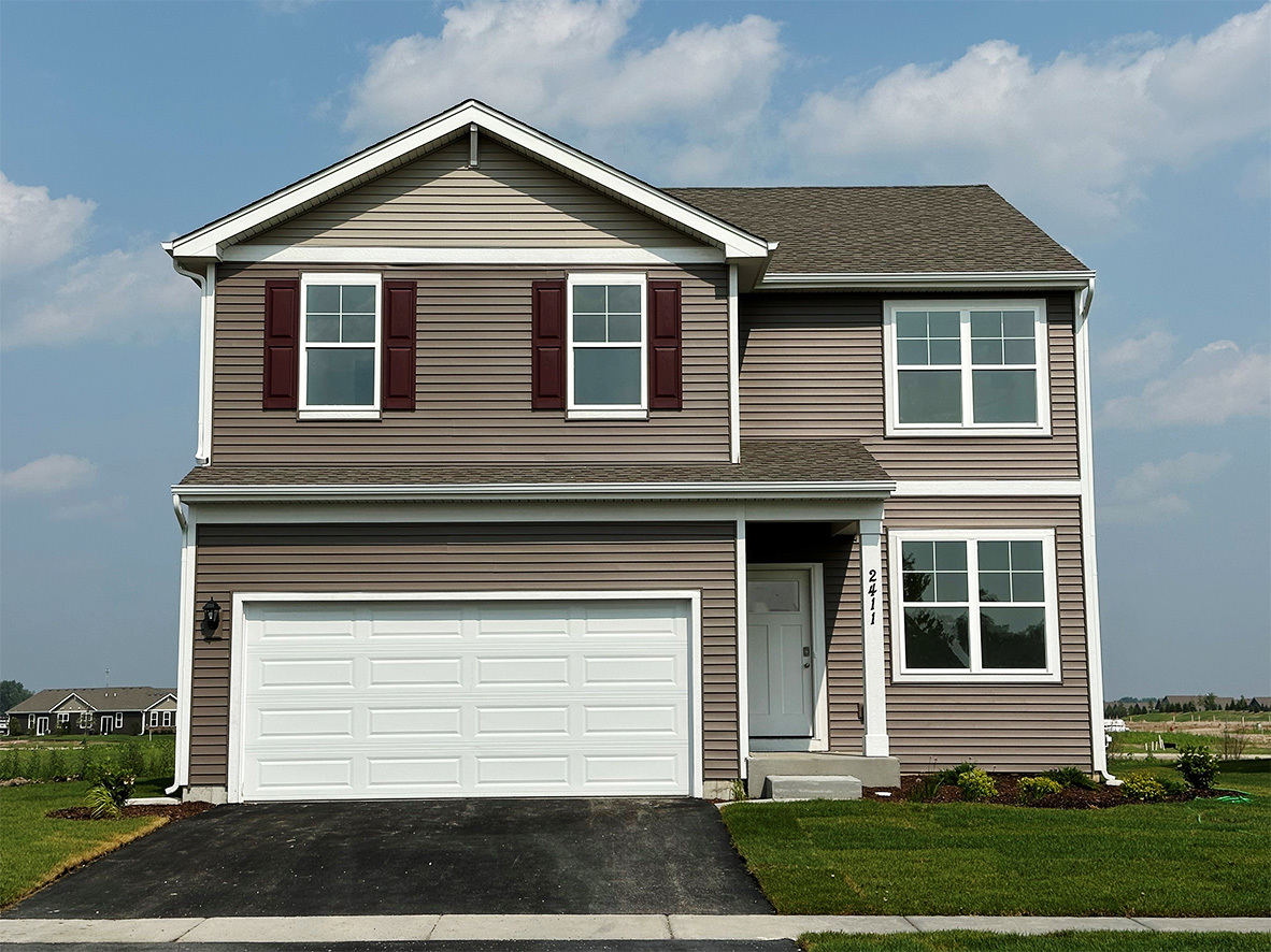 2461 Tahoe Lane Pingree Grove, IL 60140 - Photo 1 of 34 a front view of a house with a yard