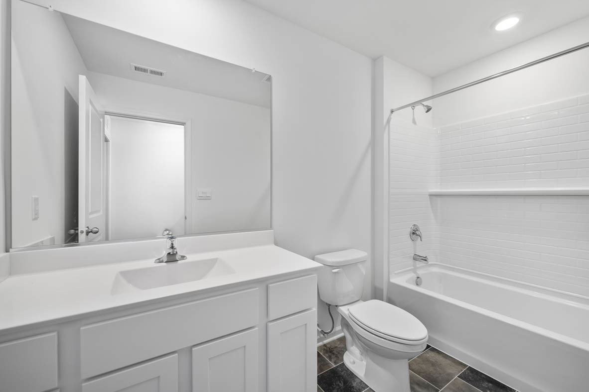 2461 Tahoe Lane Pingree Grove, IL 60140 - Photo 14 of 34 a bathroom with a sink toilet a mirror and shower