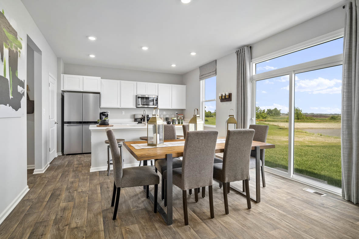 2461 Tahoe Lane Pingree Grove, IL 60140 - Photo 20 of 34 a view of a dining room with furniture window and wooden floor