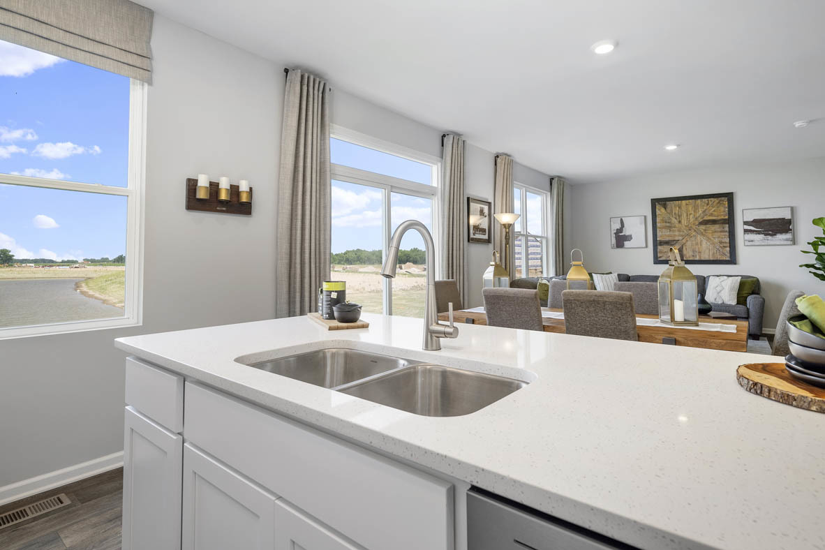 2461 Tahoe Lane Pingree Grove, IL 60140 - Photo 23 of 34 a kitchen with sink a refrigerator and cabinets