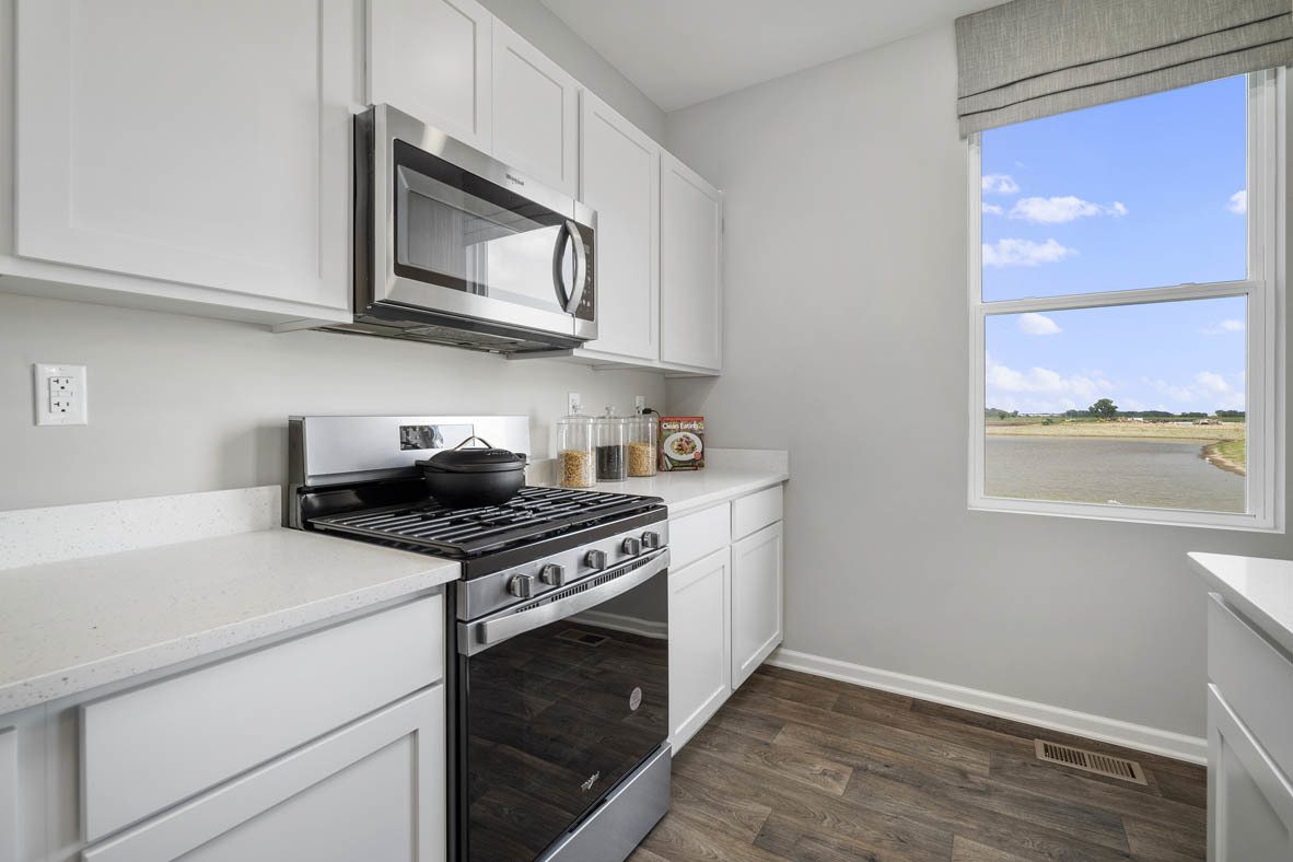 2461 Tahoe Lane Pingree Grove, IL 60140 - Photo 24 of 34 a kitchen with stainless steel appliances granite countertop white cabinets and a stove