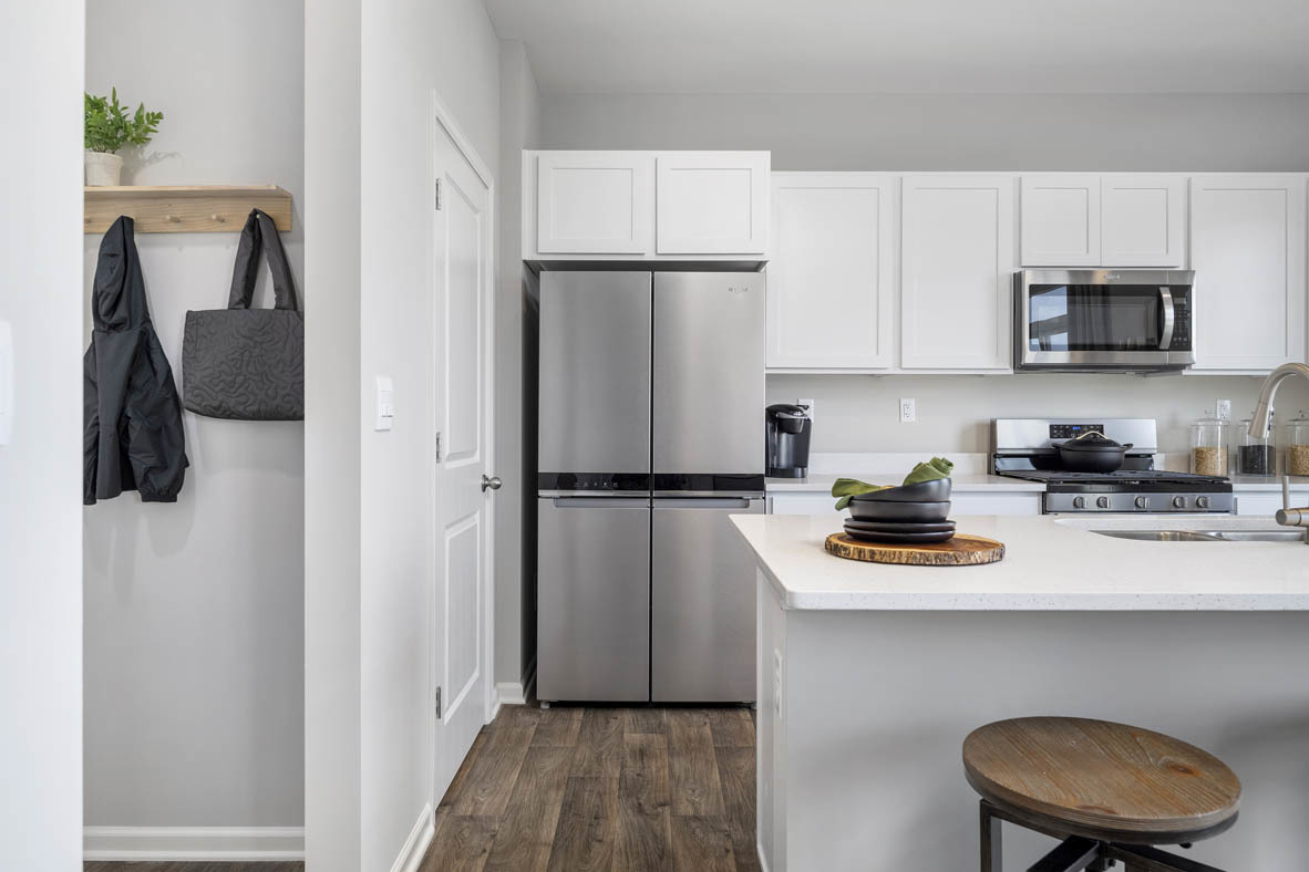 2461 Tahoe Lane Pingree Grove, IL 60140 - Photo 25 of 34 a kitchen with stainless steel appliances a refrigerator a sink a stove and white cabinets