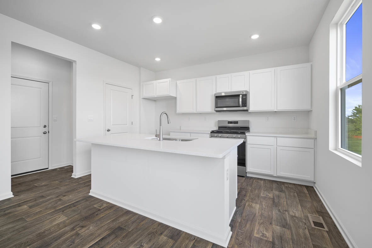 2461 Tahoe Lane Pingree Grove, IL 60140 - Photo 5 of 34 a kitchen with granite countertop a sink cabinets and stainless steel appliances