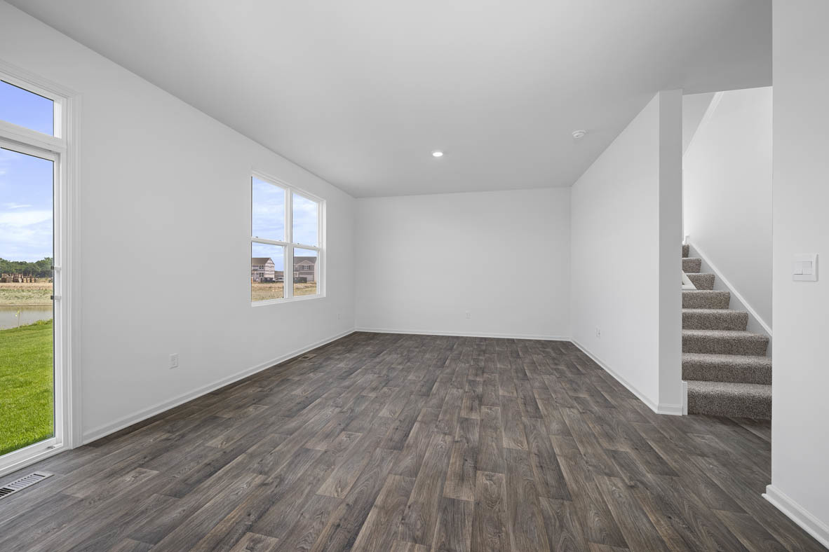 2461 Tahoe Lane Pingree Grove, IL 60140 - Photo 7 of 34 an empty room with wooden floor and windows