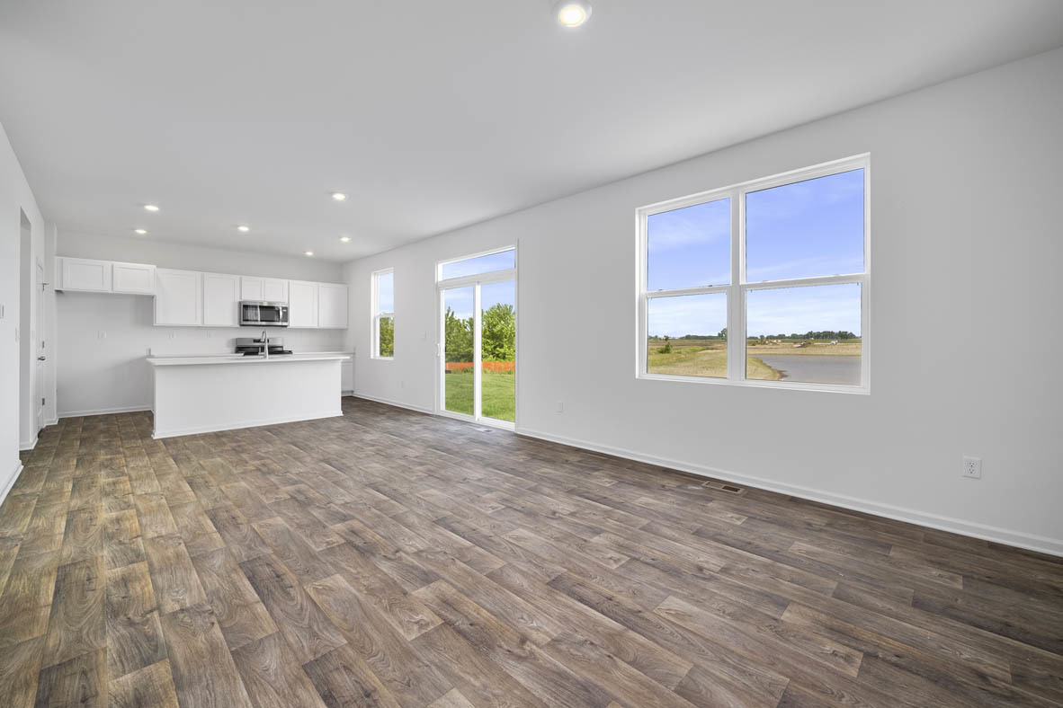 2461 Tahoe Lane Pingree Grove, IL 60140 - Photo 8 of 34 a view of an empty room with a window and wooden floor