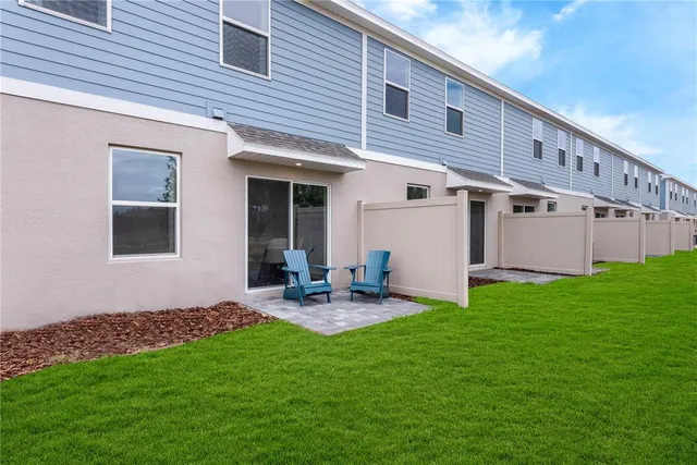 a backyard of a house with seating space