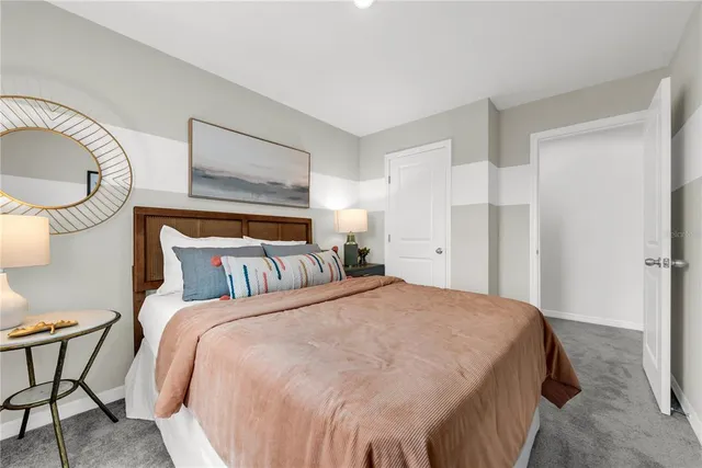 a bed room with a bed and chair