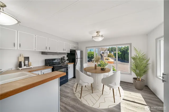 a kitchen with a table and chairs in it