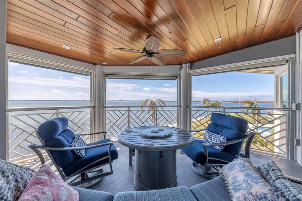 11000 Placida Road, Unit 104 Placida, FL 33946 - Photo 7 of 38 Lanai is highlighted with a Cypress ceiling and Intracoastal views as far as one can see