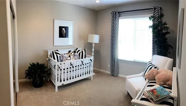 a bed room with furniture and a window