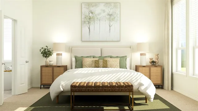 a bed sitting in a bedroom next to a window