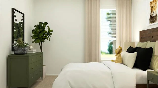 a bedroom with furniture and a potted plant